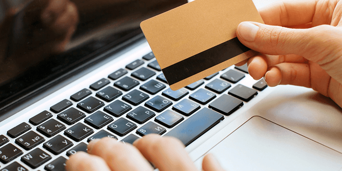 Person inserting code of prepaid card
